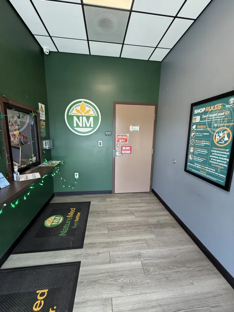 Guests are welcomed through a secure reception area before entering the dispensary showroom.