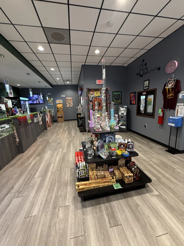 NatureMed's retail display highlights smoking accessories, glassware, and other cannabis-related products available for purchase.