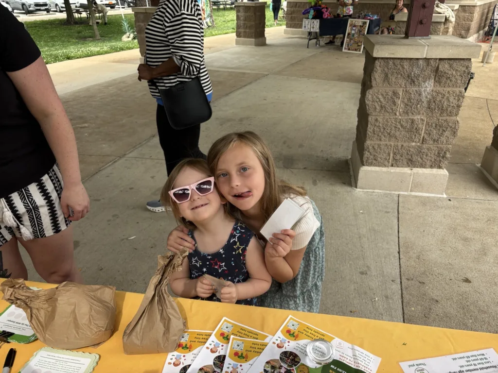 Ferguson Farmers' Market's Tiny Sprouts program pays kids to explore the market and try new produce.
