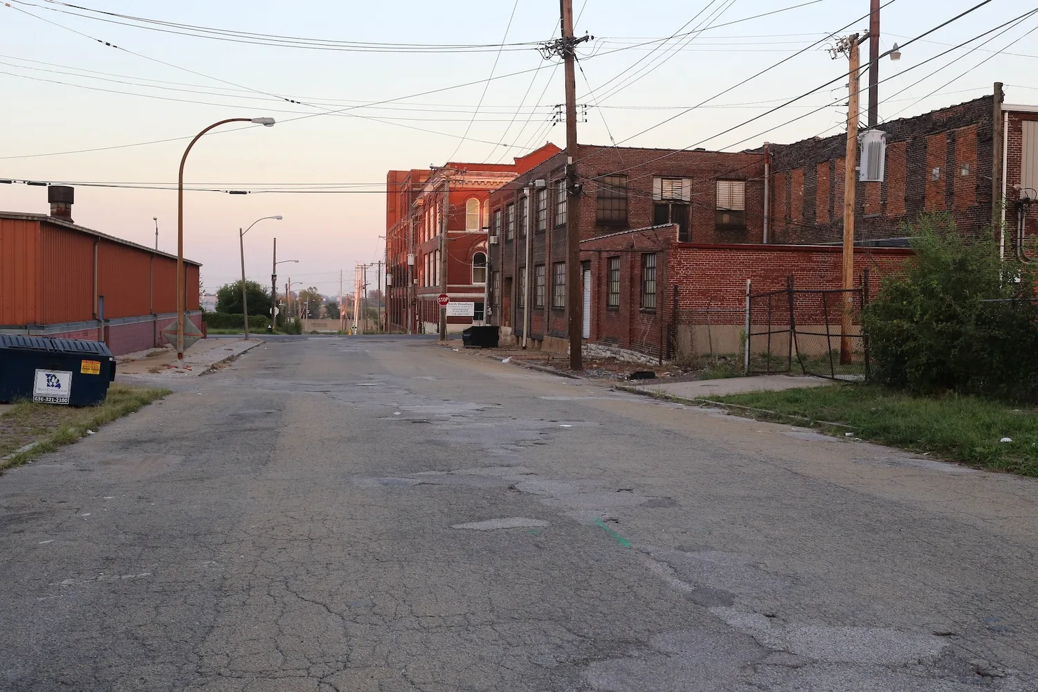 An industrial street lined with warehouses.