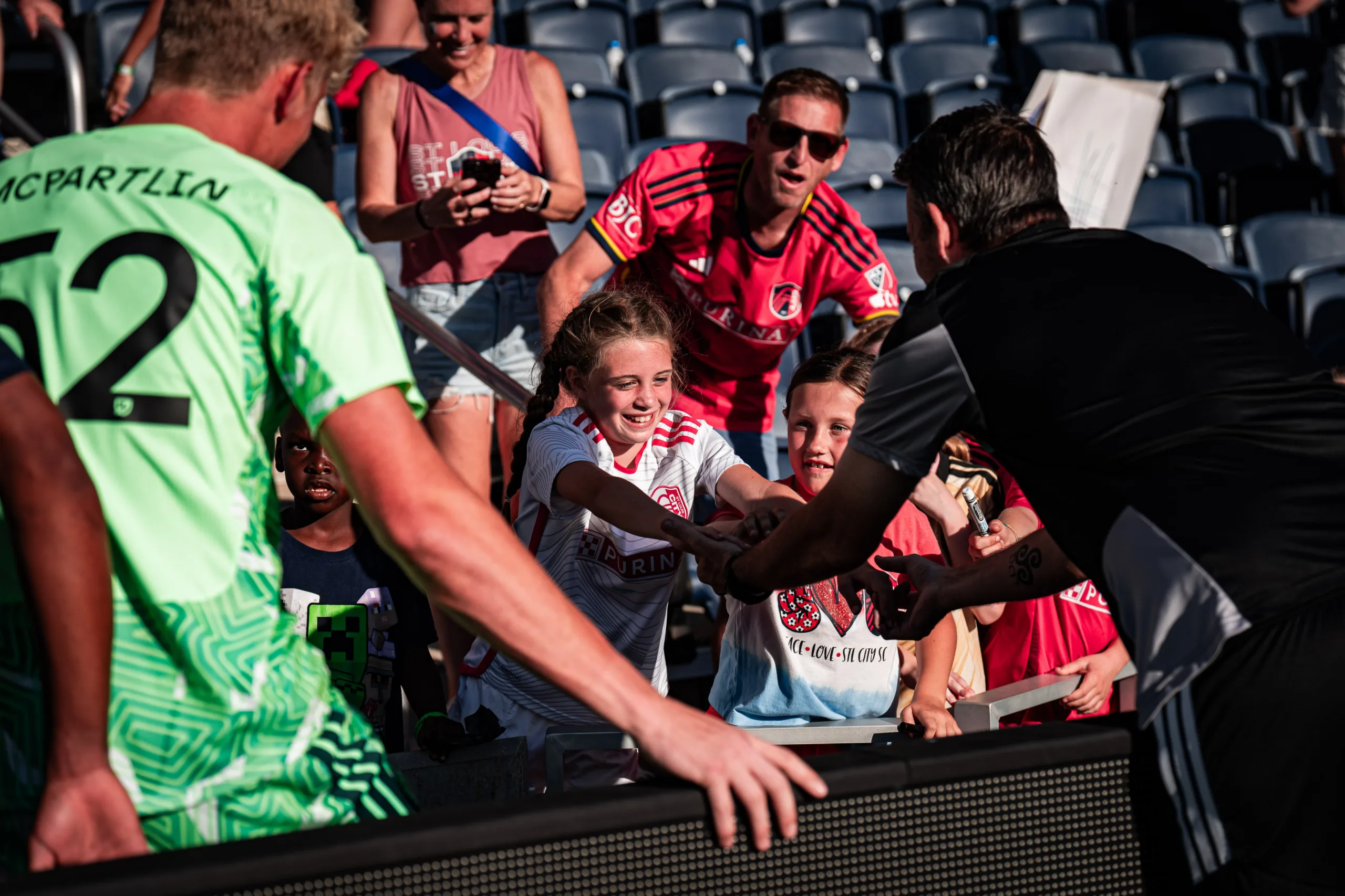 After the match, CITY2 players take time to connect with fans and sign autographs.