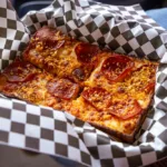A slice of pepperoni pizza from Motor Town Pizza at Energizer Park.