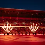 Flames shoot into the air during a pregame ceremony as fans fill the stands at Energizer Park.