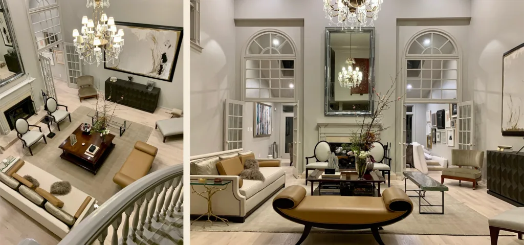 An elegant and modern formal sitting room with light gray walls and warm neutral toned furniture, a fireplace with French doors leading into the room on either side, a black credenza and a large wall-mounted abstract painting.