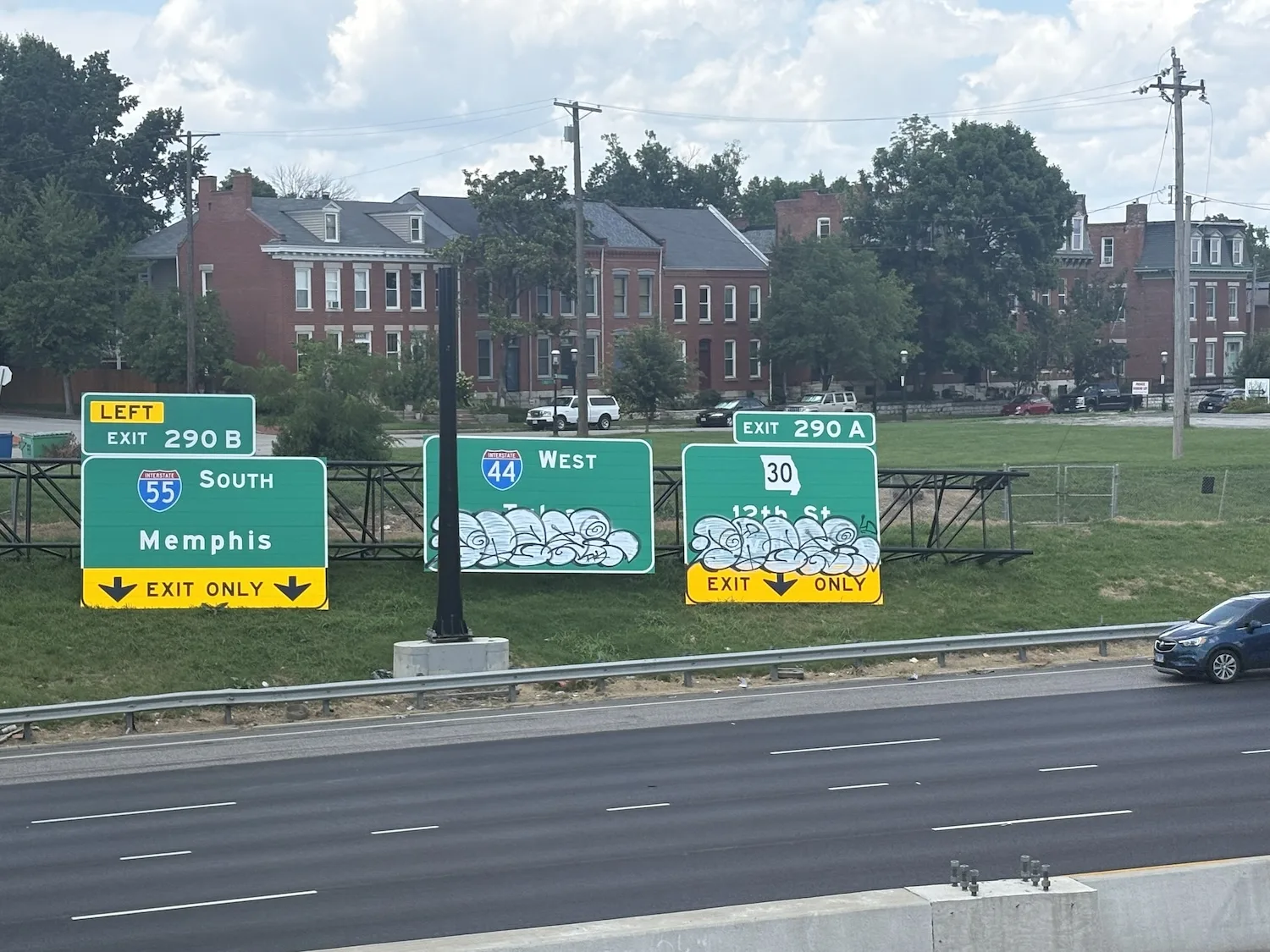 First these highway signs didn’t fit. Then came the graffiti