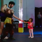Child interacting with surprise Romeo & Zooliet puppet guest