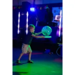 Child playing with dance party props