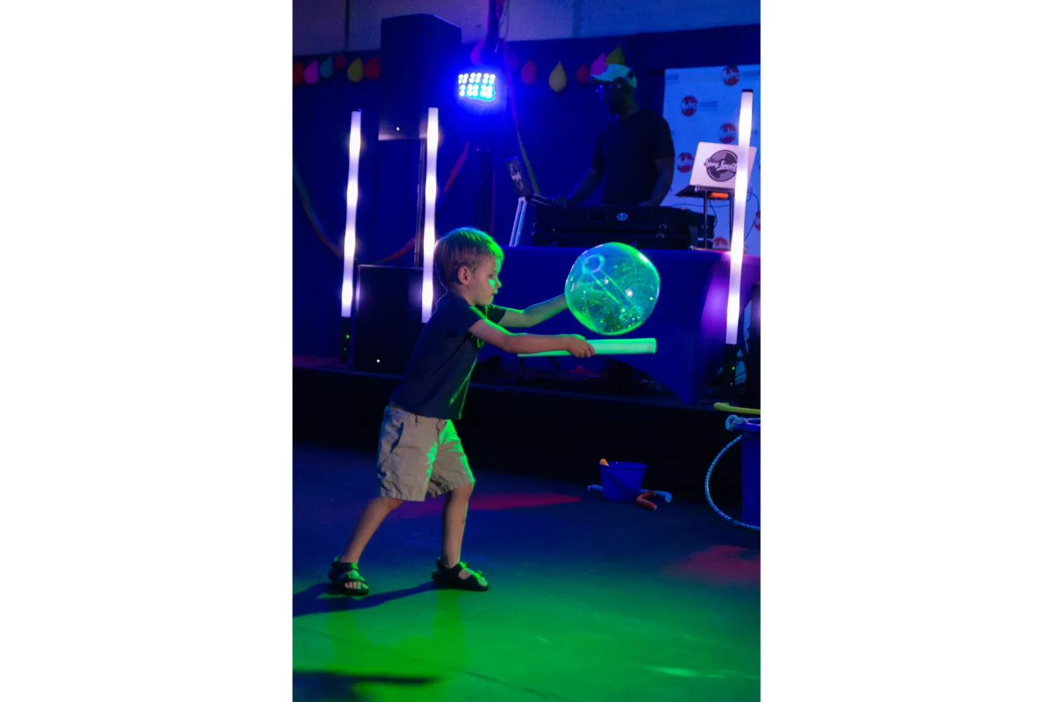 Child playing with dance party props