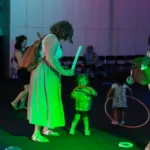 Mom and child dancing to music at Metro Theater