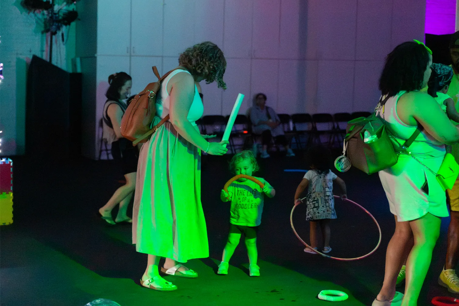 Mom and child dancing to music at Metro Theater