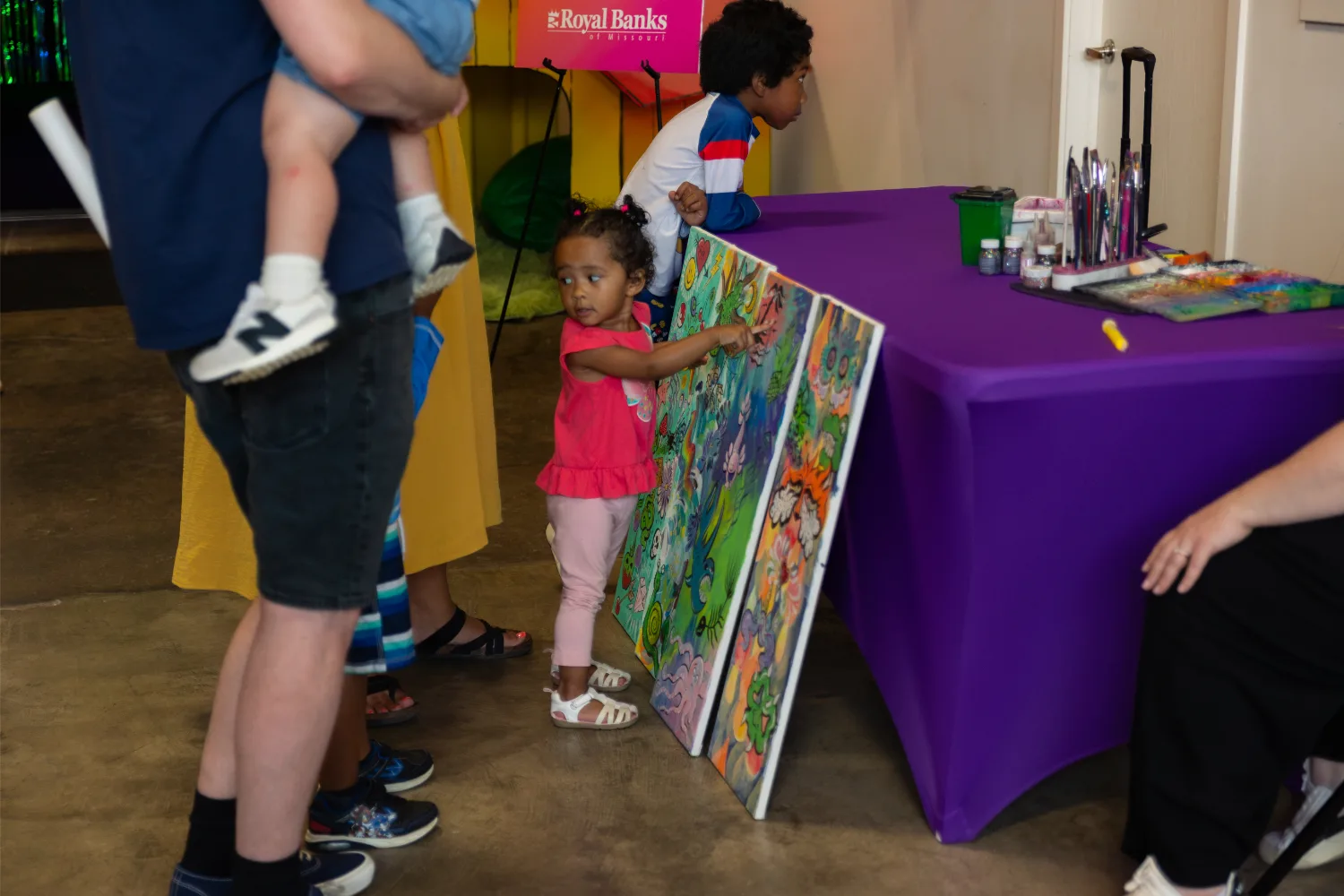 Child choosing face paint design