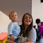 Mom and child smiling after getting some face paint