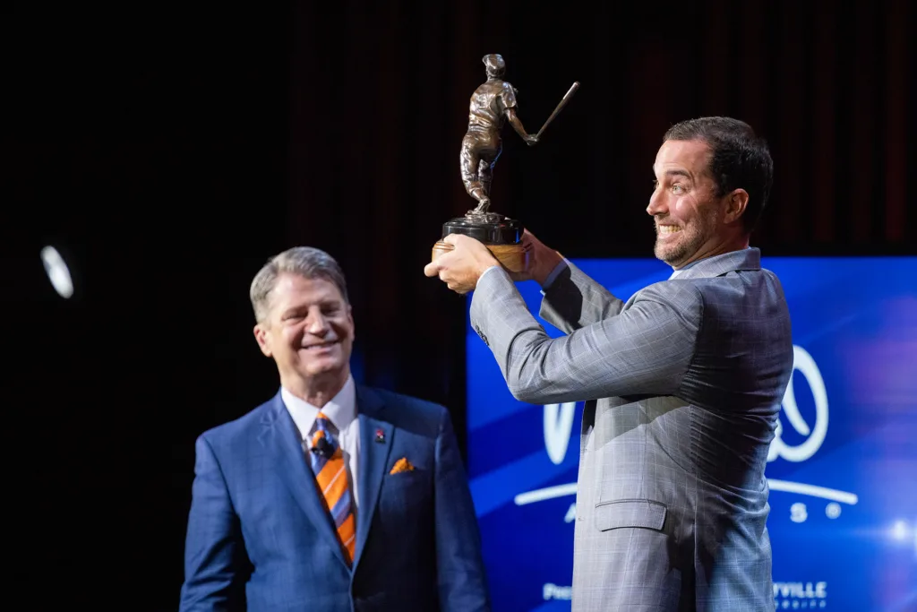 Adam Wainwright celebrates after receiving the Extraordinary Character Award at the 2023 Musial Awards.