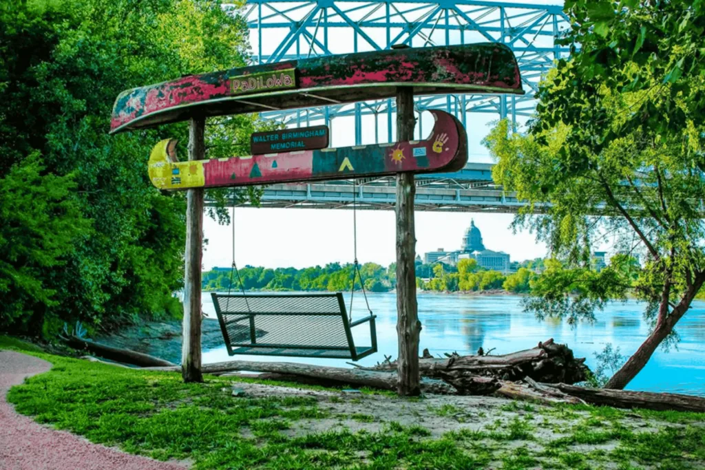 The Walter Birmingham Memorial at Noren River Access Park features a colorful canoe swing overlooking the Missouri River.