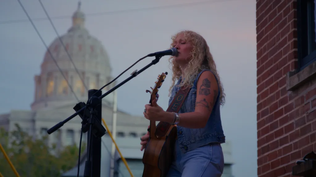 A musician performs during an outdoor concert at The Red Wheel, one of downtown Jefferson City's popular gathering places for live music and local entertainment.