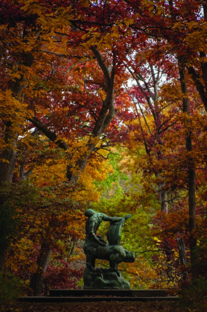 Fall foliage surrounds one of the sculptures at Allerton Park & Retreat Center.