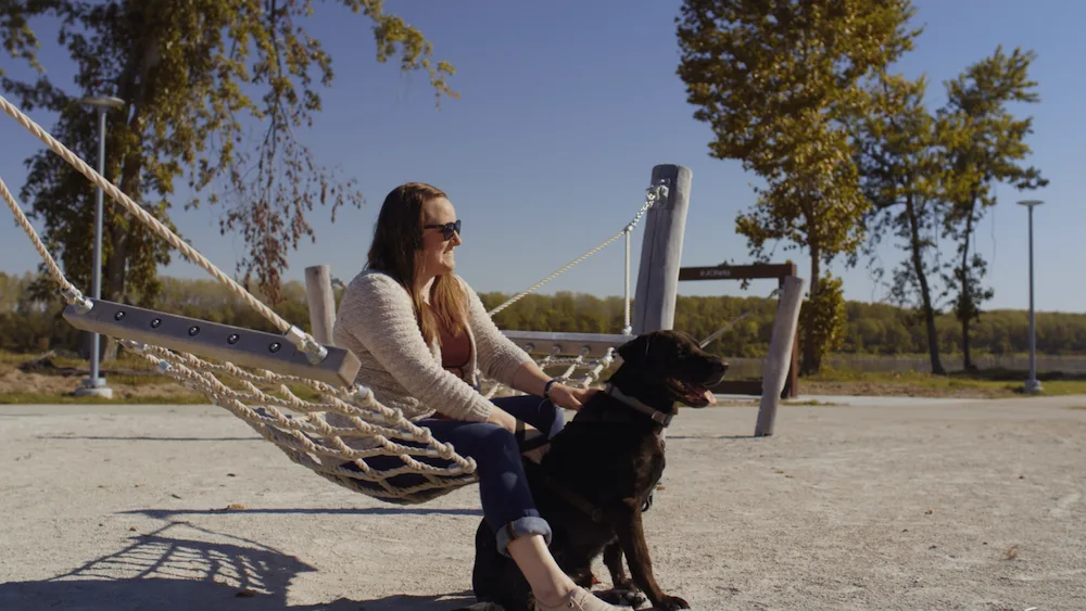 A hammock and sandy riverfront make Noren River Access Park a relaxing spot for visitors and their pets.