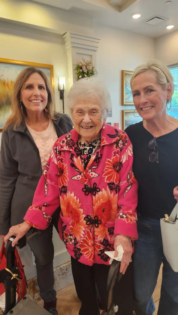 A Kinwell resident enjoys a visit with family, sharing smiles and quality time together.