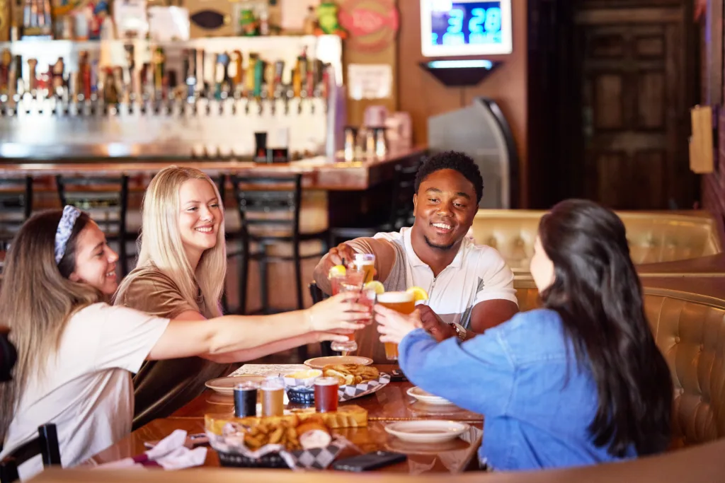 Friends gather for drinks and a meal at Hoppers Pub