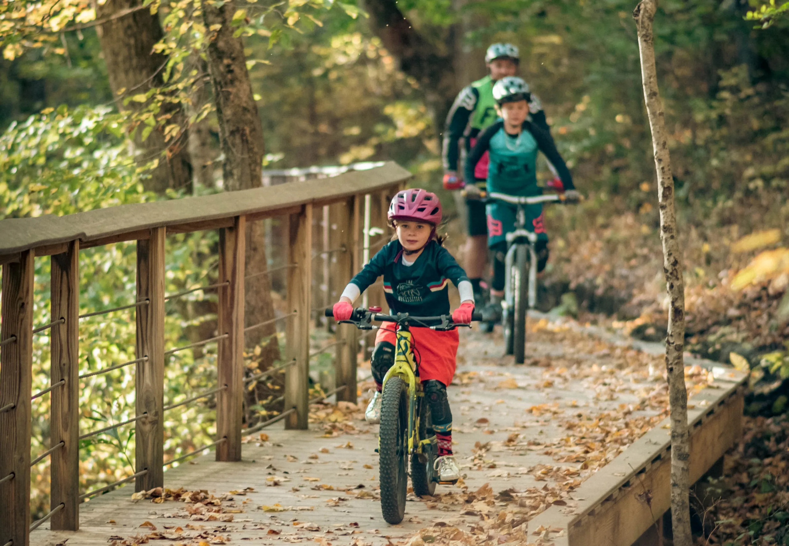 A family enjoys cycling and exploring the trails at Rotary Park.