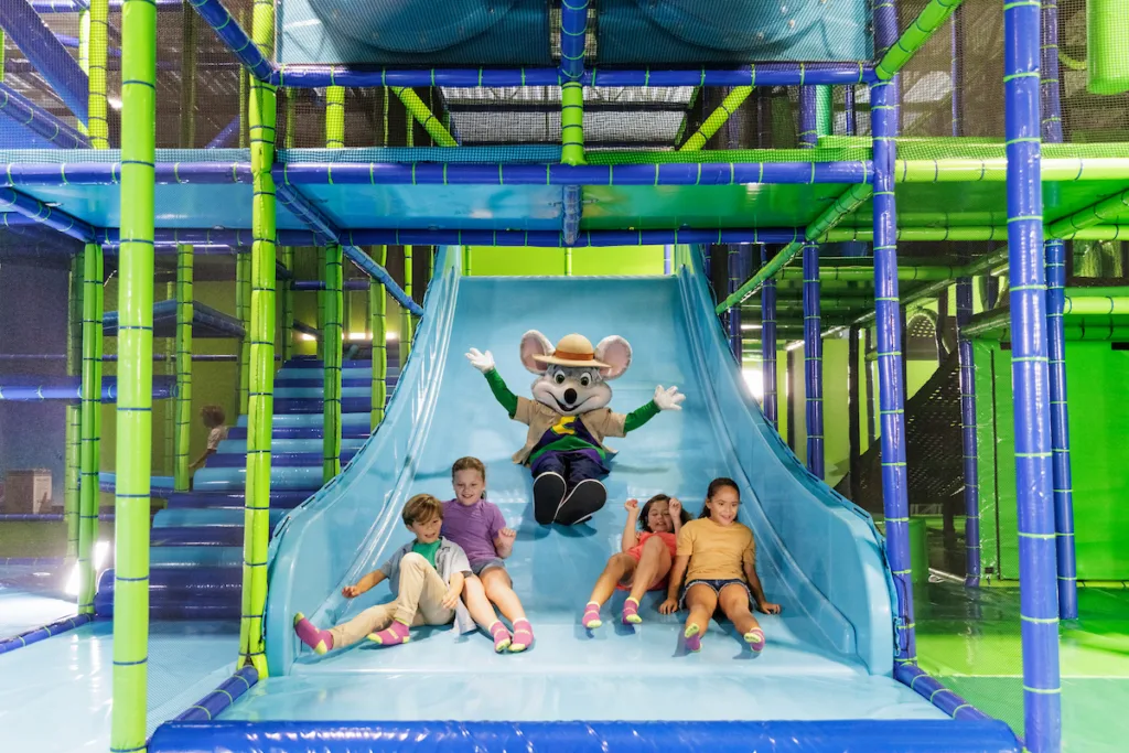 Safari Chuck E. Cheese sliding with kids at Chuck E. Cheese Adventure World on Saturday, Sept. 26, 2026, in Chandler, Ariz.