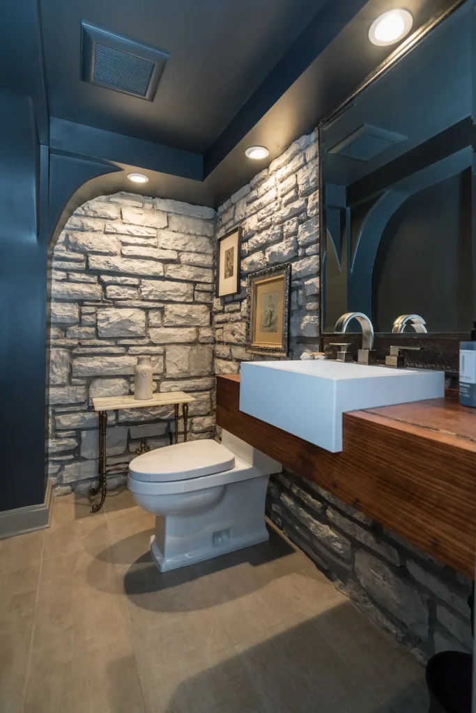 When a toilet can’t be tucked out of sight, thoughtful materials and finishes can help incorporate it into the overall design of the room.