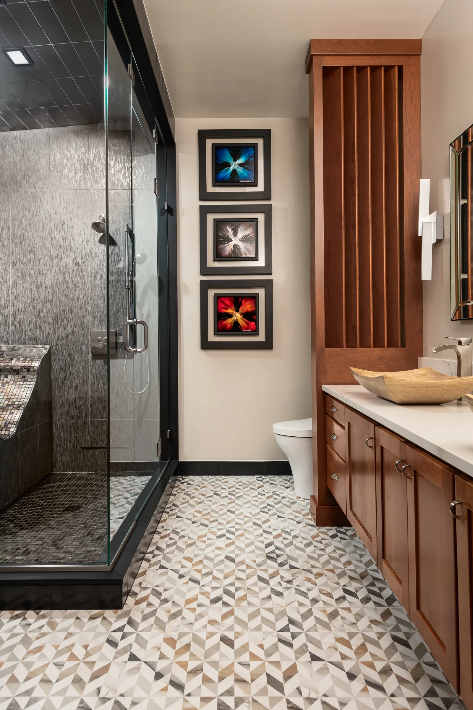 A strategically placed privacy panel helps keep the toilet from becoming the focal point.