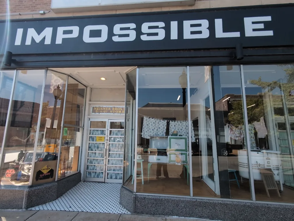 A sign on a storefront.