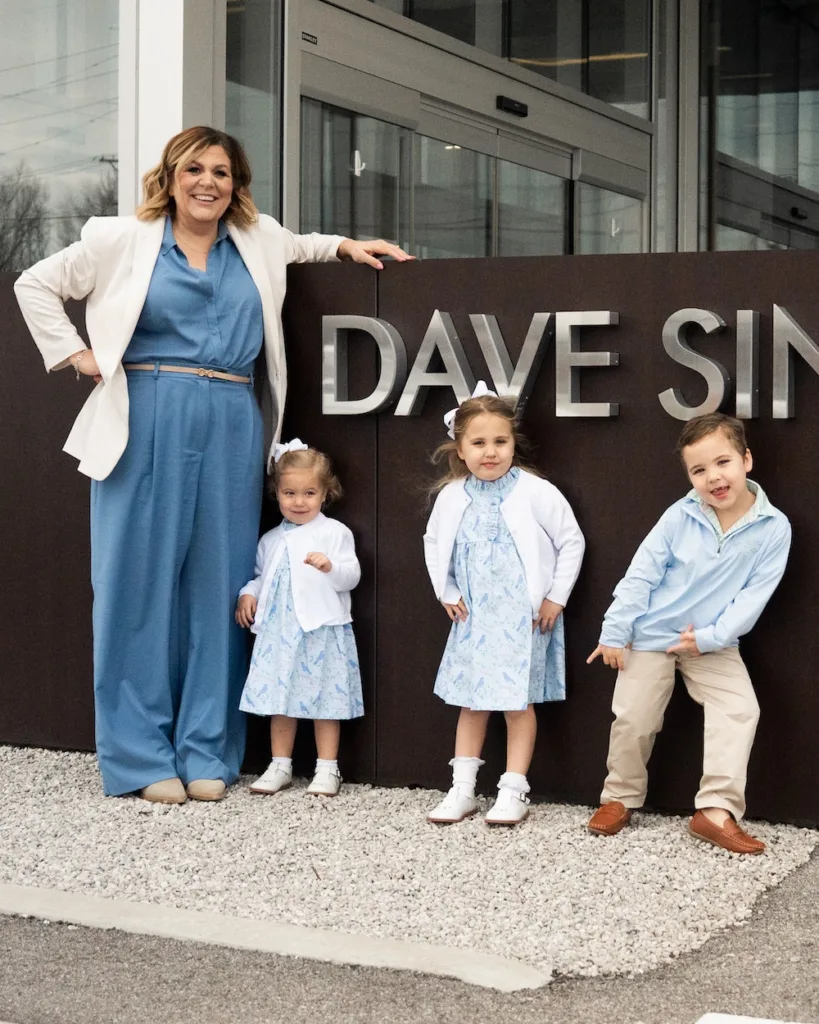 Megan Sinclair and her three children outside Dave Sinclair Lincoln.