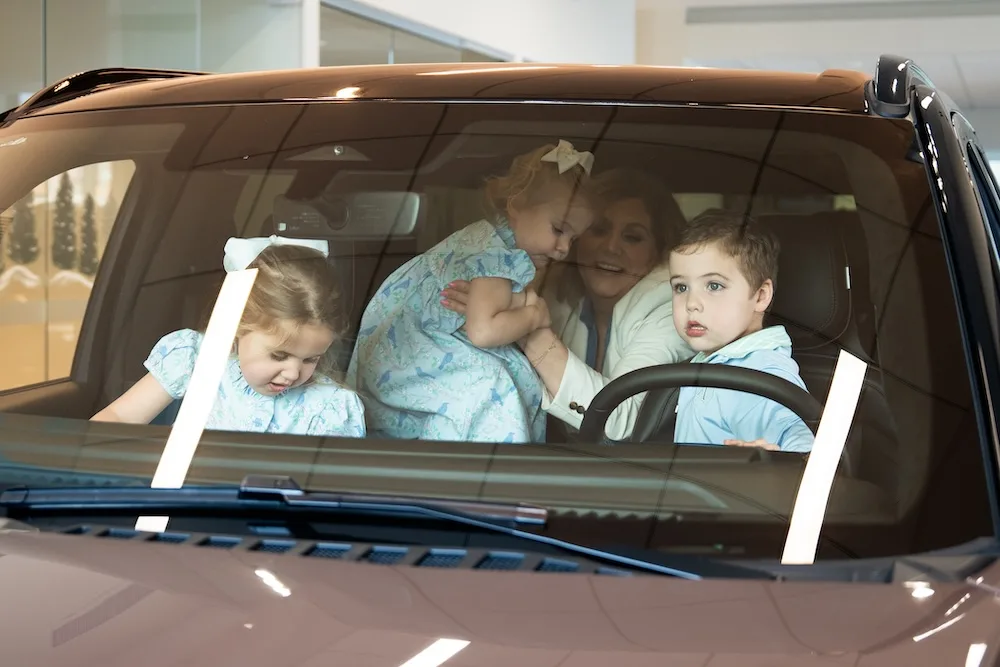 Megan Sinclair and her children inside a Lincoln.
