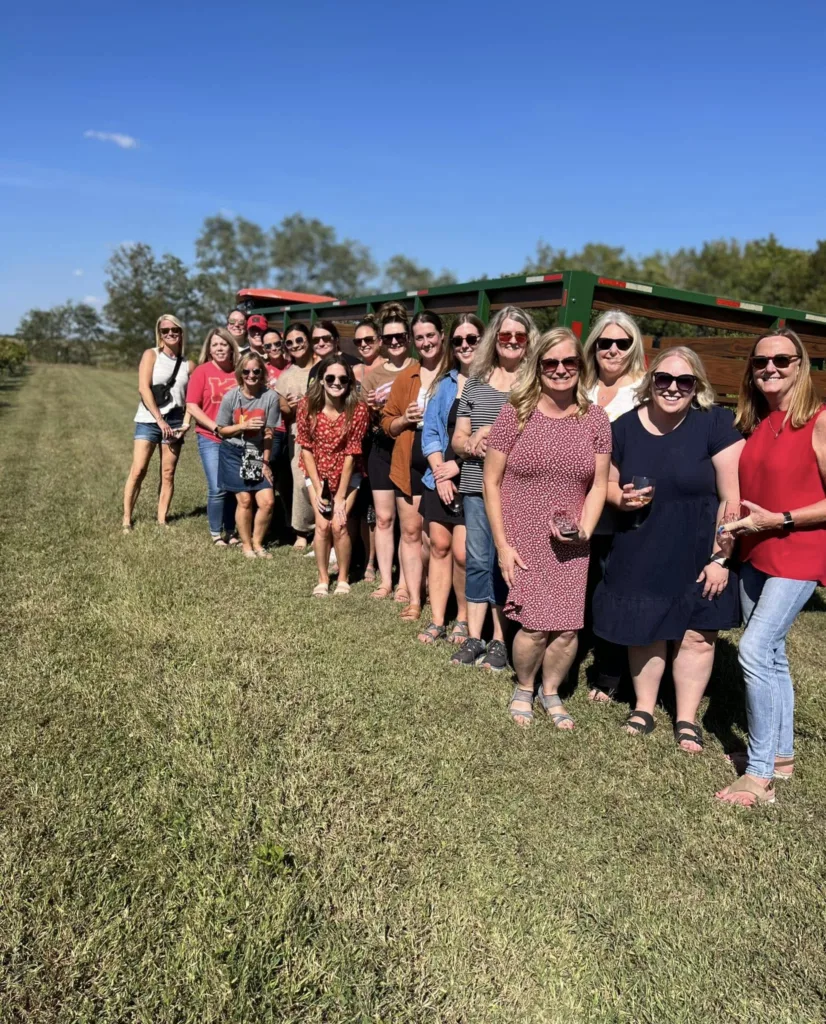 A group enjoys a sunny day and hayride experience at Jowler Creek Vineyard & Winery.