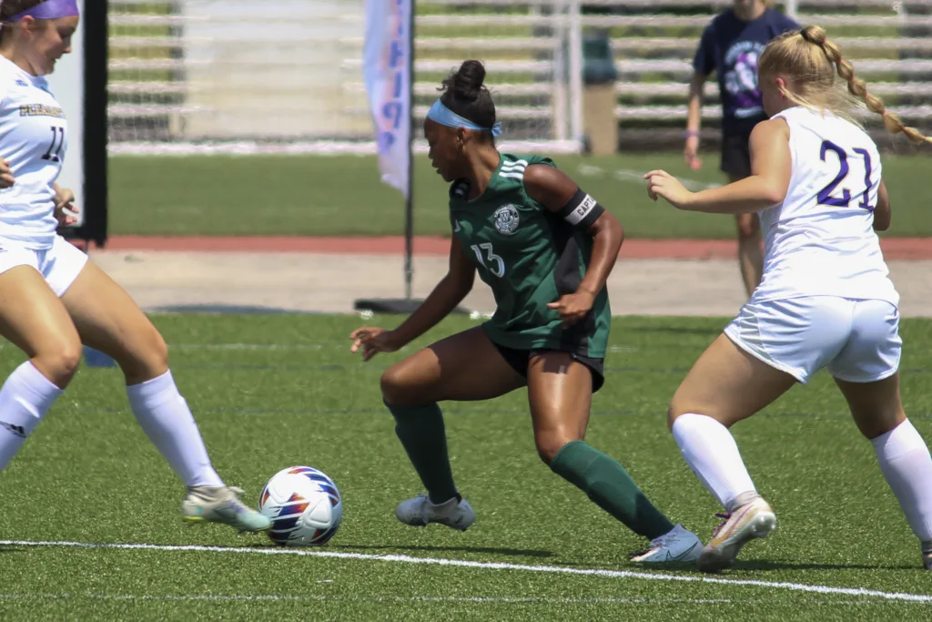 Whitfield’s own Mia Devrouax takes the field during her time as a Warrior.