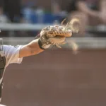 A Whitfield varsity baseball player makes a catch behind the plate.