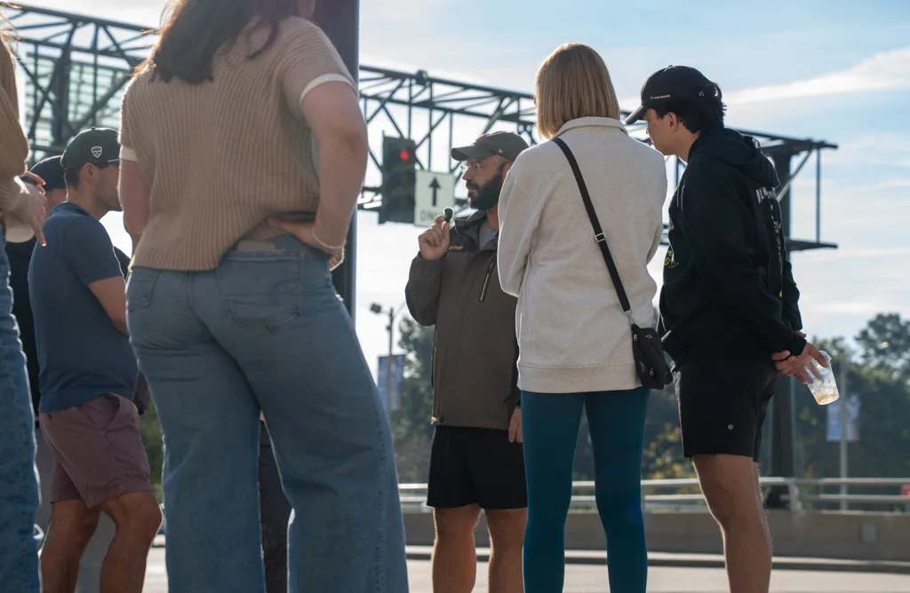 A man speaking to a group of people.