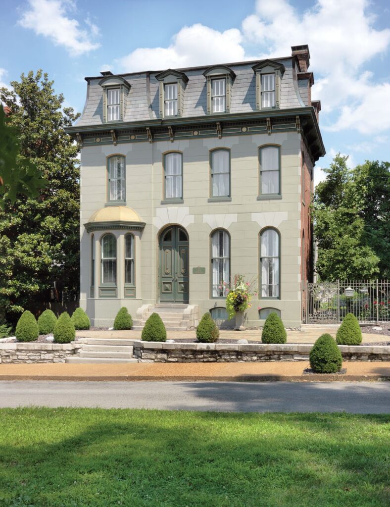 This Lafayette Square home has an arched front door painted a shade of green.