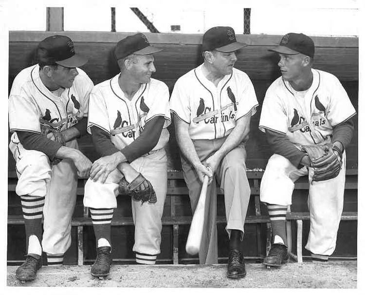 Gussie%20Busch%20talking%20with%20Cardinals%20players%20in%20the%20dugout.jpg